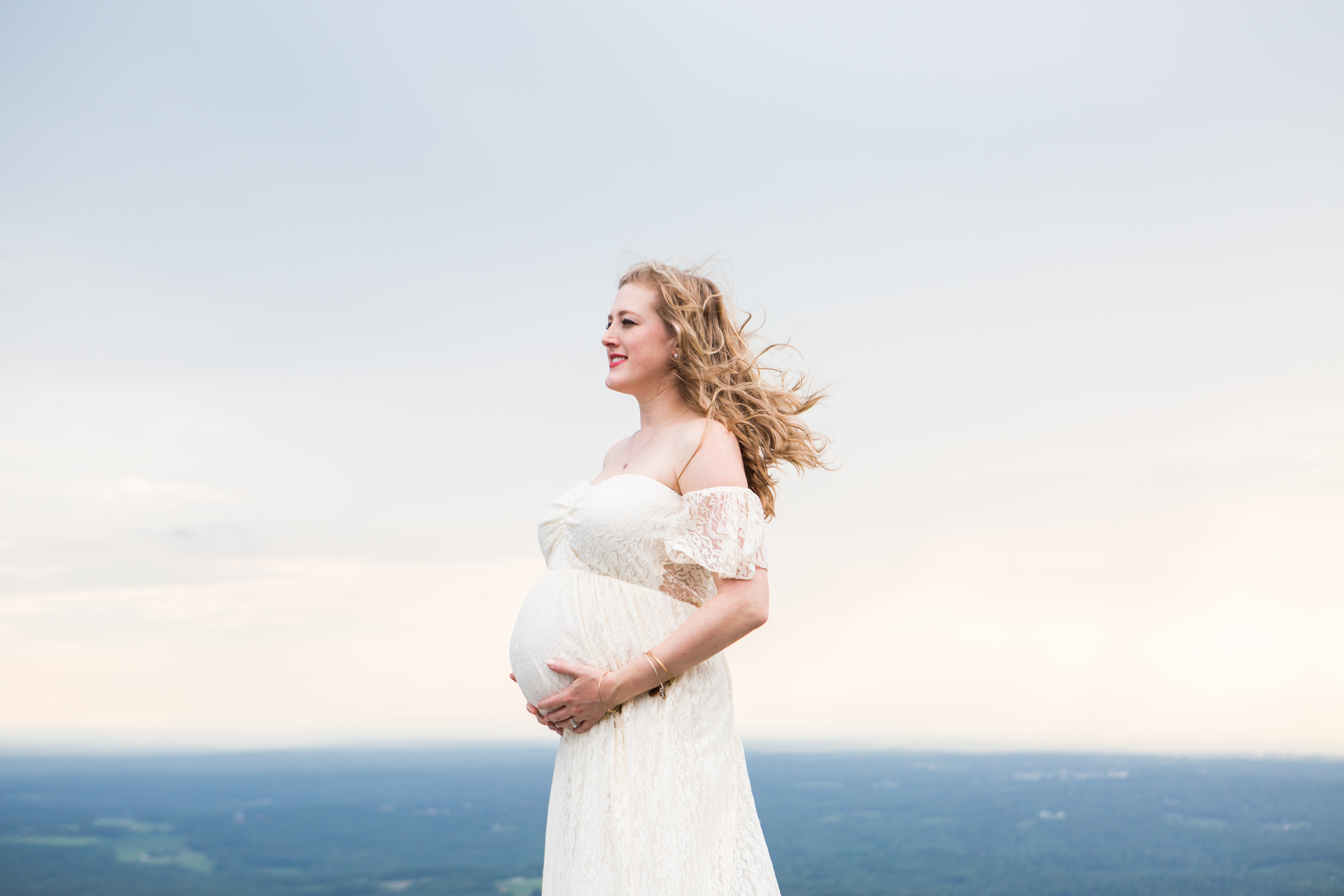 pregnant mother cream maternity dress pilot mountain posing ledge